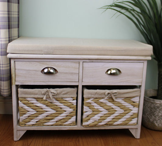 Whitewashed wooden bench with drawers and baskets